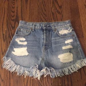 High-waisted distressed jean shorts